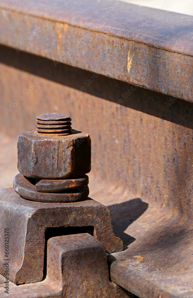 close-up of rusty iron bolts on the railway close-up of rusty iron bolts on the railway