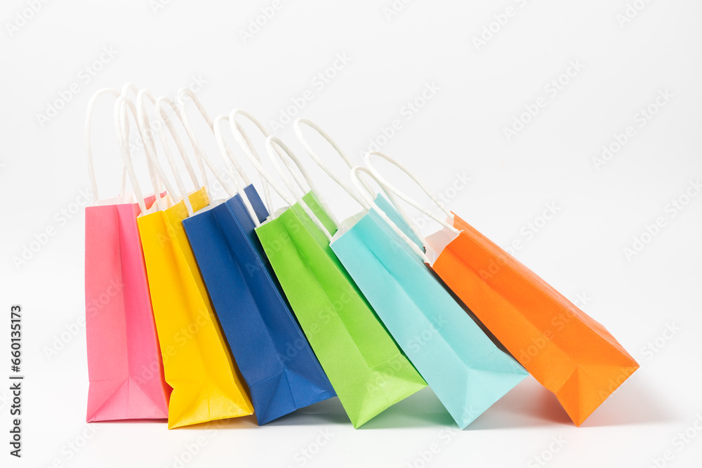 Multi colored gift or shopping bags isolated on white background