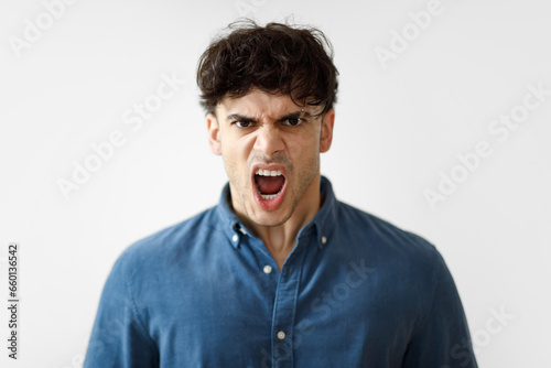 Mad Arab Man Shouting Looking At Camera On White Background