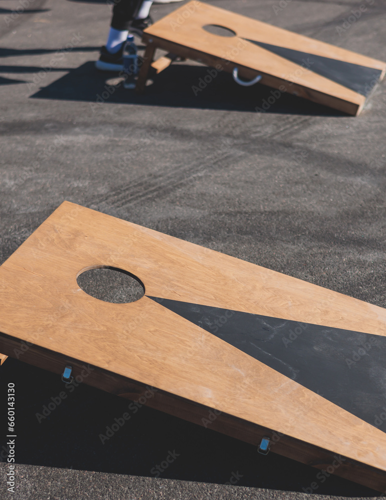 Cornhole game set, process of throwing bean bags, kids children tossing ...