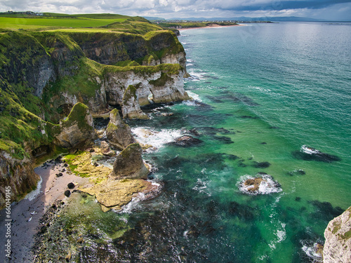 Coastal cliffs at Gulls Point near Portrush on the Antrim Causeway Coast Path - these rocks are of the Hibernian Greensands Formation and Ulster White Limestone Formation - chalk and sandstone. photo