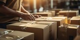 Warehouse Efficiency: A Worker Expertly Packs Boxes of Shipping Products for Swift and Smooth Delivery Operations