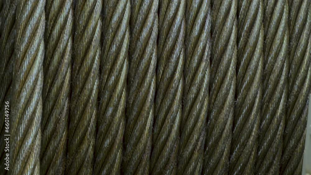 Metal winch cable. Metal rope wound on a spool. Metal winch cable. Metal rope wound on a spool.