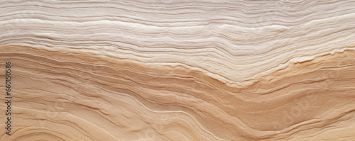 Closeup of sandstone with intricate ripple patterns, resembling the delicate lines of a fingerprint. The stones surface is smooth to the touch, with each ripple creating a subtle indent.