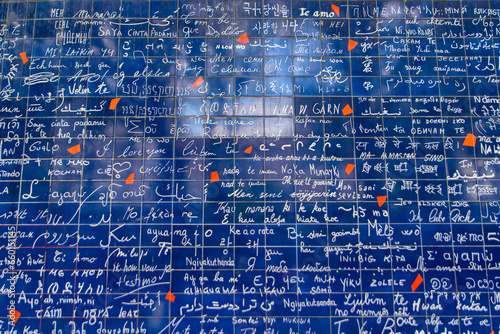 Wall of Love, a travel landmark with different languages of love on the wall in  Montmartre, Paris, France, Europe