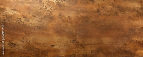 Closeup of a brushed bronze texture with a pitted, textured surface. The texture has a rich, earthy quality that brings to mind natural elements, while the bronze color adds a touch of luxury.