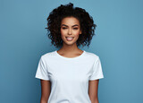 portrait of a black woman with white clear t shirt isolated in blue studio