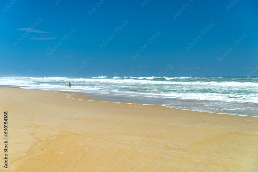 Deserted shore, waves and sky of the Atlantic Ocean