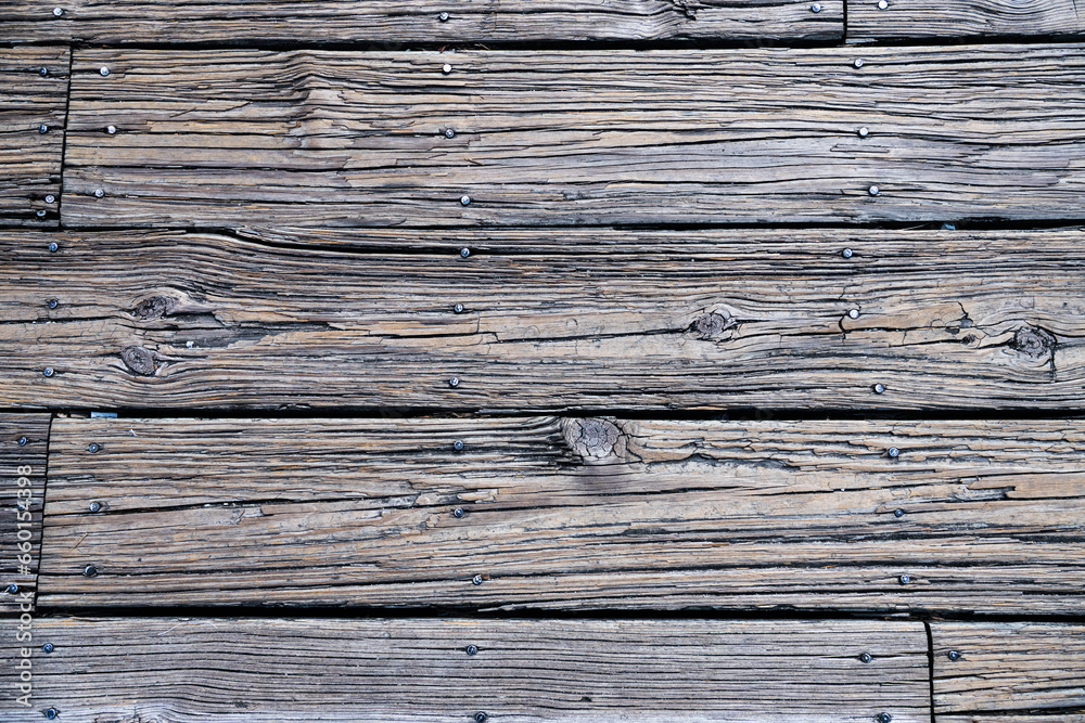 Texture of an old wooden board. Fragment of a sidewalk with nails. Space for text. Texture of an old wooden board. Fragment of a sidewalk with nails. Space for text.