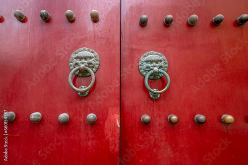 A close-up of the red gate of traditional Chinese classical architecture photo