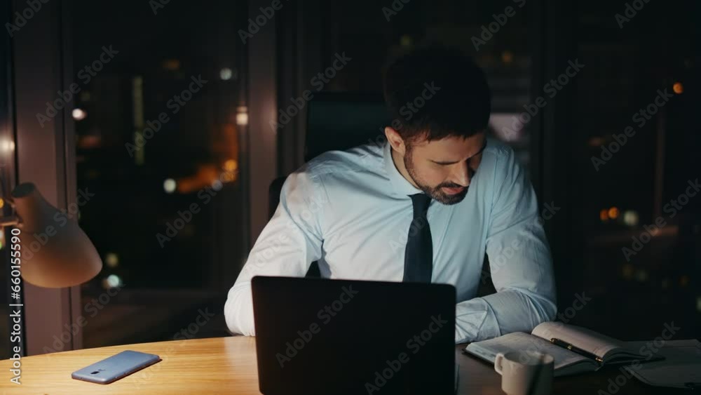 Distressed businessman looking computer worried problem at night office close up Distressed businessman looking computer worried problem at night office close up