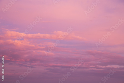 Pink purple violet cloudy sunrise sky. Beautiful soft gentle sunset with clouds background texture © Viktor Iden