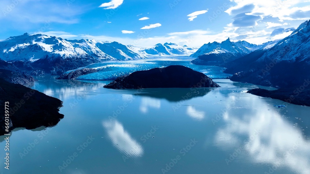 Grey Glacial At Torres Del Paine In Puerto Natales Chile. Snowy Mountains. Glacial Landscape. Puerto Natales Chile. Winter Background. Grey Glacial At Torres Del Paine In Puerto Natales Chile. - obrazy, fototapety, plakaty 