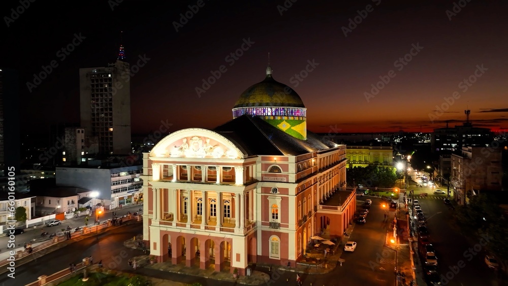 Colorful sunset sky over medieval building at cityscape downtown Manaus Brazil near Amazon river and Amazon Forest. Travel destinations. Sunset skyline. Sunset coastal city at Manaus Brazil. Colorful sunset sky over medieval building at cityscape downtown Manaus Brazil near Amazon river and Amazon Forest. Travel destinations. Sunset skyline. Sunset coastal city at Manaus Brazil.