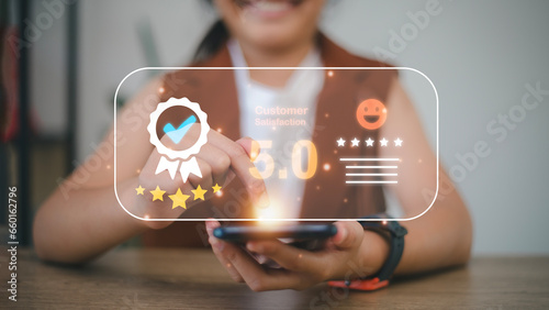 User gives rating to service experience on online application  Customer review satisfaction feedback survey concept  Customer can evaluate quality of service leading to reputation ranking of business.