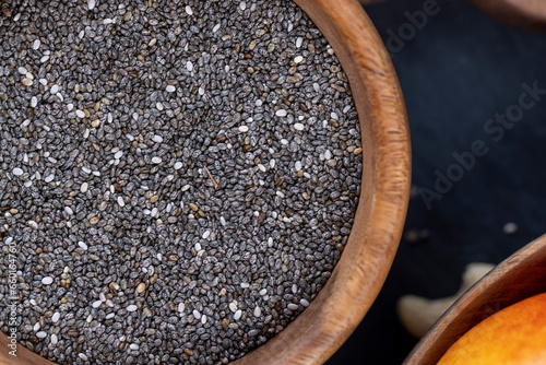 raw chia seeds rich in vitamins and minerals , wooden bowl photo