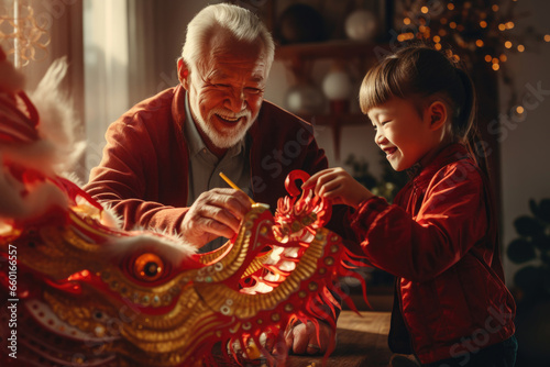 Happy grandfather and grandson make New Year gifts near the 2024 symbol of the dragon on the background of the Christmas tree © Konstiantyn Zapylaie