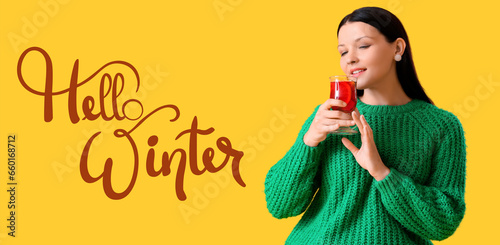 Banner with pretty woman drinking tasty mulled wine and text HELLO, WINTER photo