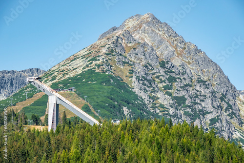 Принти на полотні Ski jumping bridge in the summer in the mountains