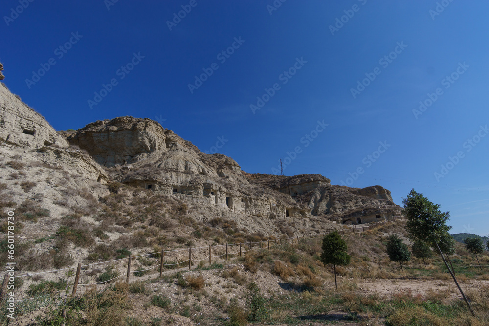 Human made caves inside the rock of a hill in Arguedas, Bardenas Reales, Navarra, Spain