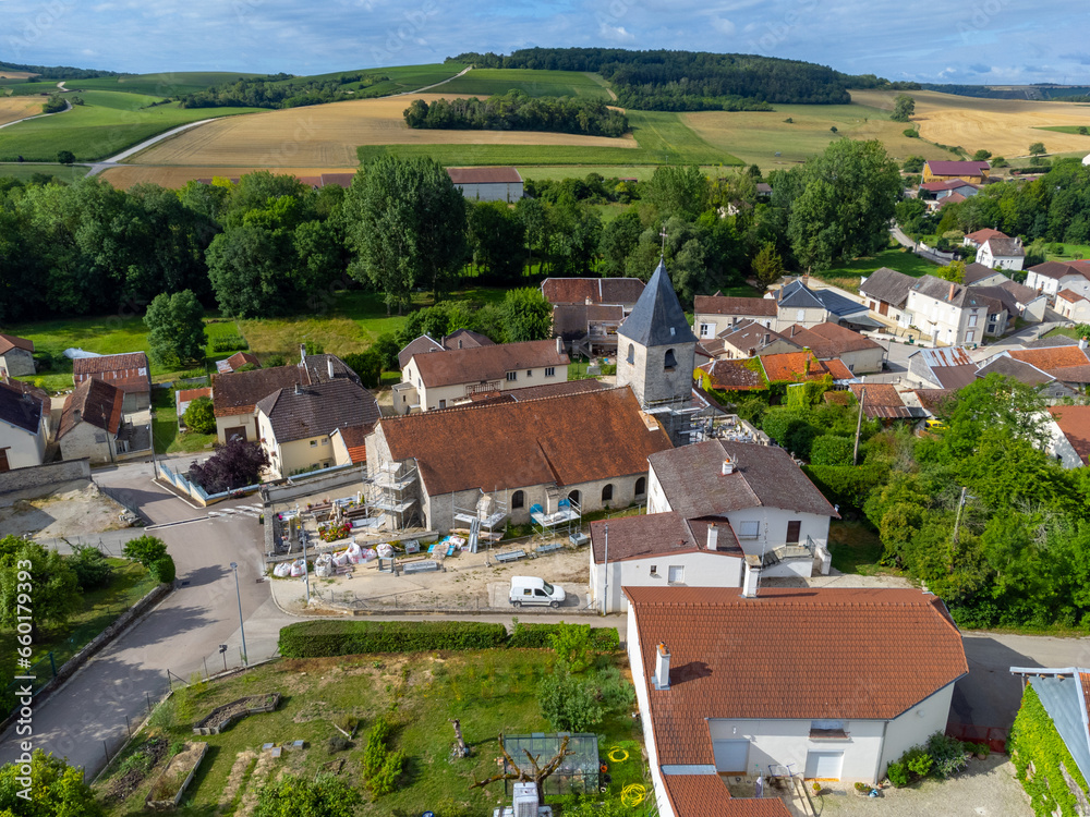 Aerial view on hilly vineyards and village Urville, champagne vineyards in Cote des Bar, Aube, south of Champange, France