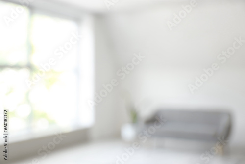 Blurred interior of living room with air conditioner and sofa © Pixel-Shot