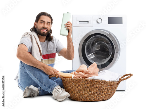 Young man with laundry bask...