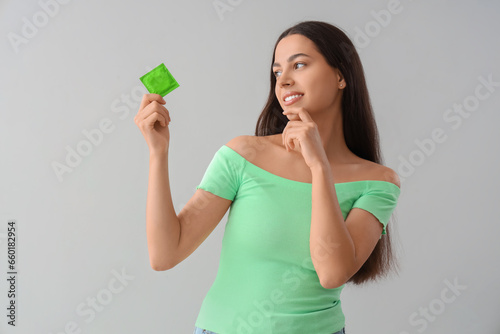 Thoughtful young woman with...