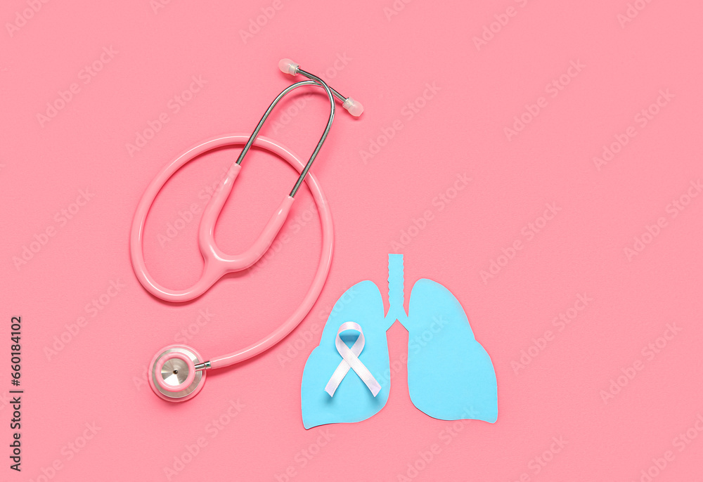 Paper lungs, stethoscope and white ribbon on pink background. Lung cancer concept Paper lungs, stethoscope and white ribbon on pink background. Lung cancer concept