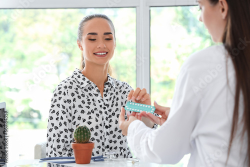 Female gynecologist giving ...