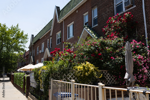 Canvas Print Beautiful Neighborhood Homes and Sidewalk with Flowers and Plants in Astoria Que