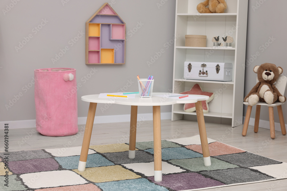 Obraz premium Child`s playroom with different toys and modern furniture. Stylish kindergarten interior