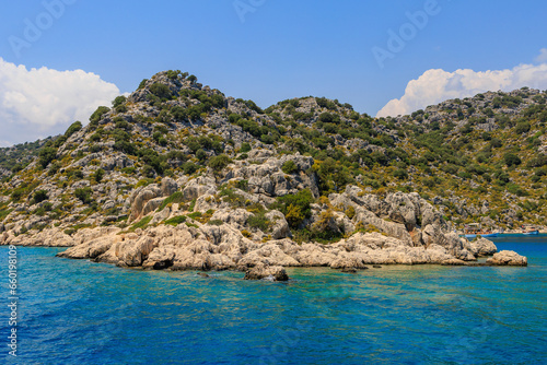 View of the rocky shore from the sea. Mediterranean Sea in Turkey. Popular tourist places. Background