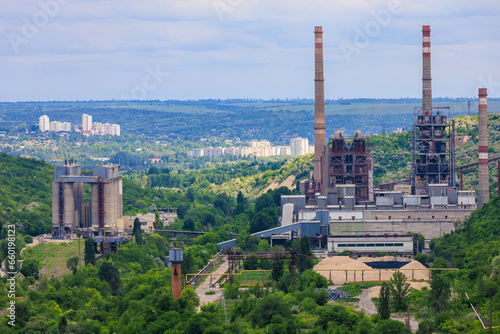 Plant or factory. Industrial area in a picturesque beautiful green area. Background with selective focus and copy space