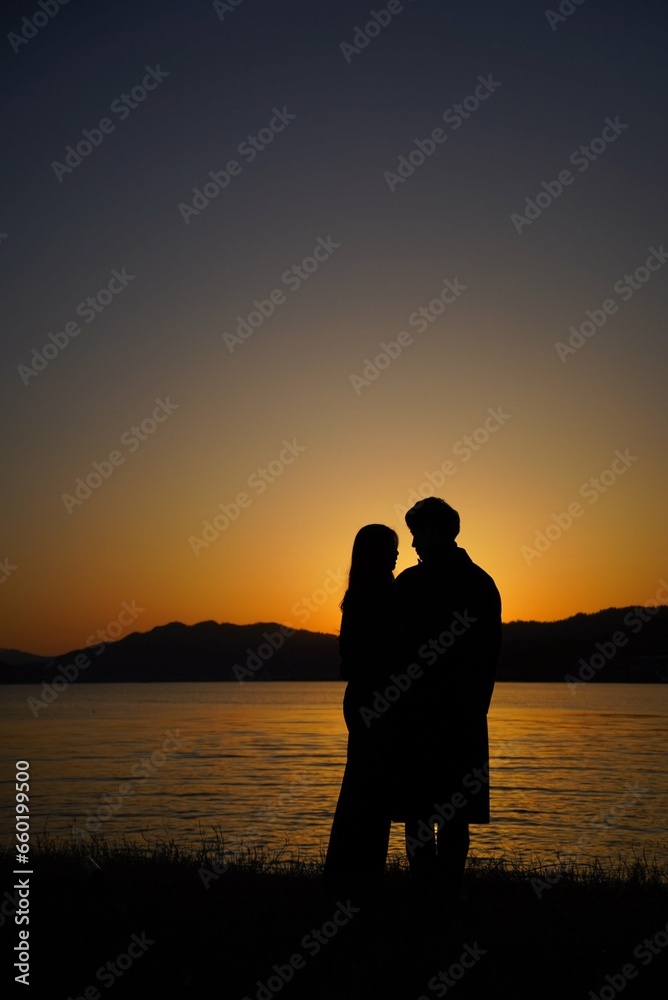 silhouette of a couple on the beach