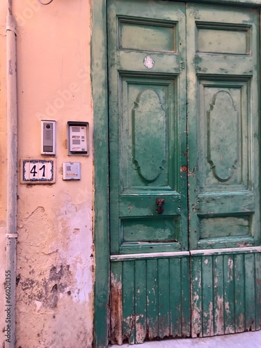 Green door on stucco © Bethany