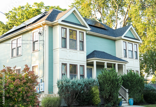 suburban house symbolizing the dream of home ownership in an era of rising mortgage prices and inflation