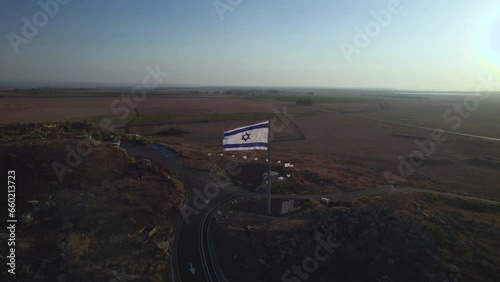 Israeli flag on Mitzpe Tel Saki in the Golan Heights - it's a memorial area of the war between Syria and Israel - this is an Israeli bunker and guard area the northern border in the Yom Kippur War photo