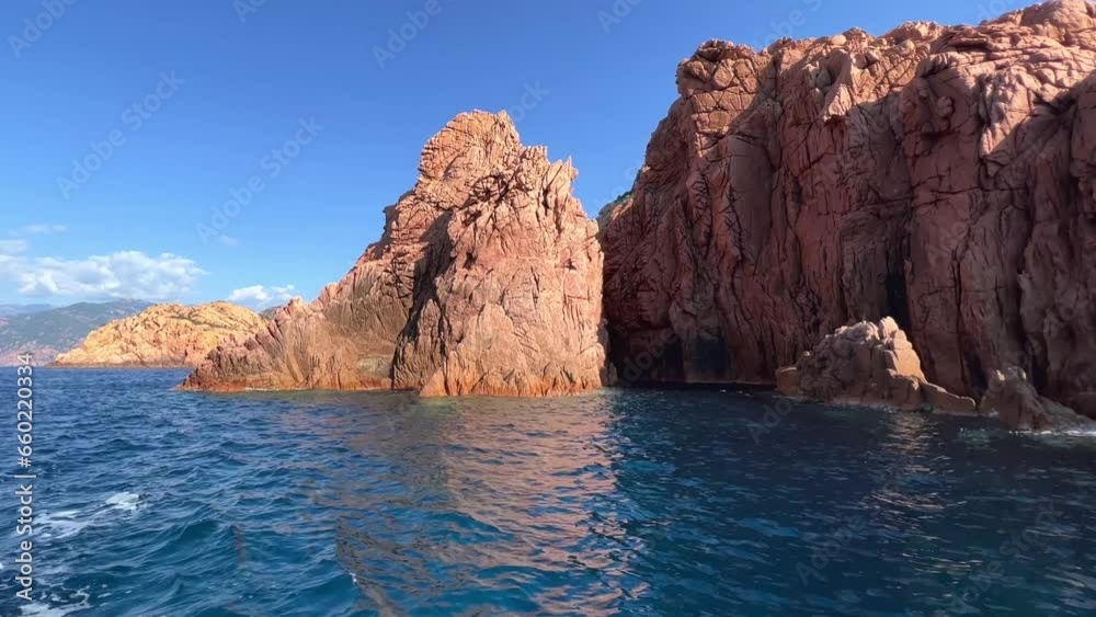 Magnificent rock formations of Calanques de Piana seen from tour boat on Mediterranean Sea in Corsica in summer season, France Magnificent rock formations of Calanques de Piana seen from tour boat on Mediterranean Sea in Corsica in summer season, France