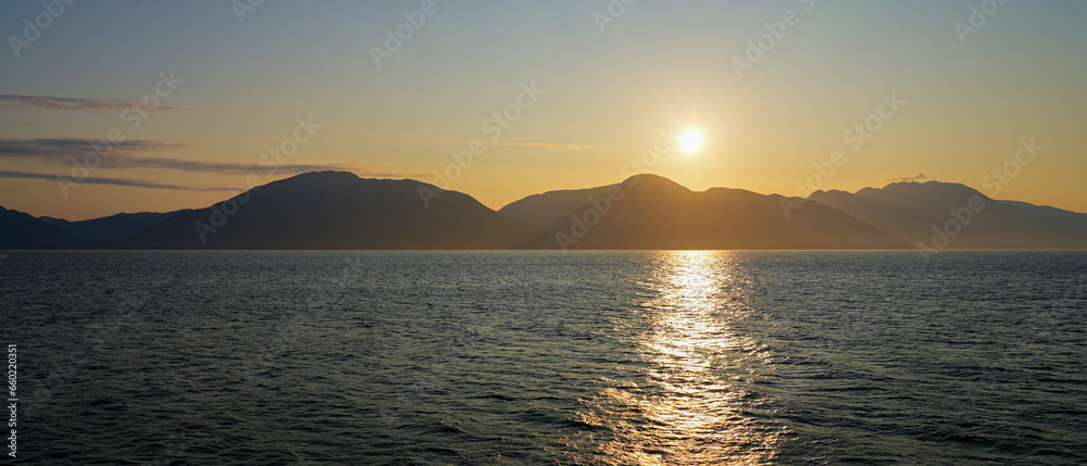 Sunset on the waters of the Inside Passage of Southeastern Alaska in the Pacific Ocean, USA Sunset on the waters of the Inside Passage of Southeastern Alaska in the Pacific Ocean, USA