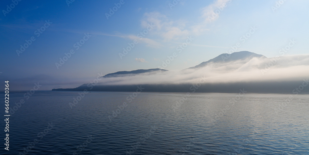 Early morning view of Kuiu Island with low clouds in the Inside Passage of Southeastern Alaska in the Pacific Ocean, USA