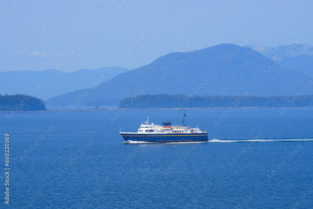 Ferry boat navigating the fjords of the Inside Passage of Southeastern Alaska in the Pacific Ocean, USA