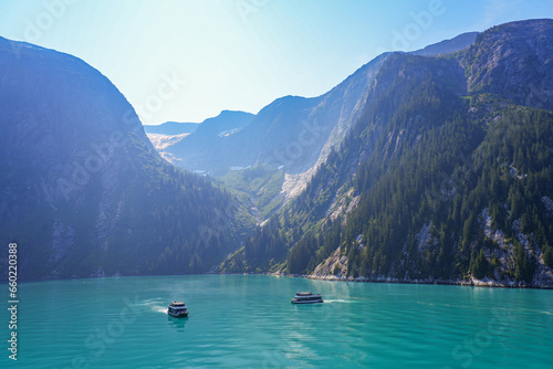Sightseeing boat navigating among the mountains of Tracy Arm Fjord near Juneau in southeastern Alaska, USA photo