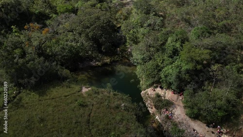 aerial view of Poço das Esmeraldas in Chapada dos Veadeiros Goiás Brazil green water, sunny day, waterfall, rocks and cerrado vegetation photo