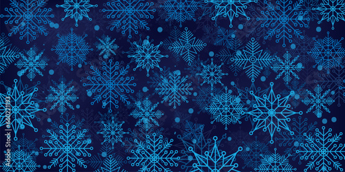 Christmas background of beautiful complex snowflakes in blue colours