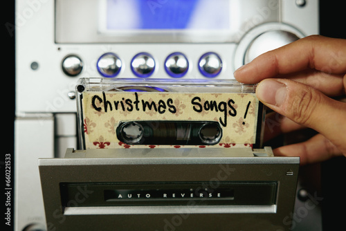 Close up from hand and cassette tapes with Christmas songs