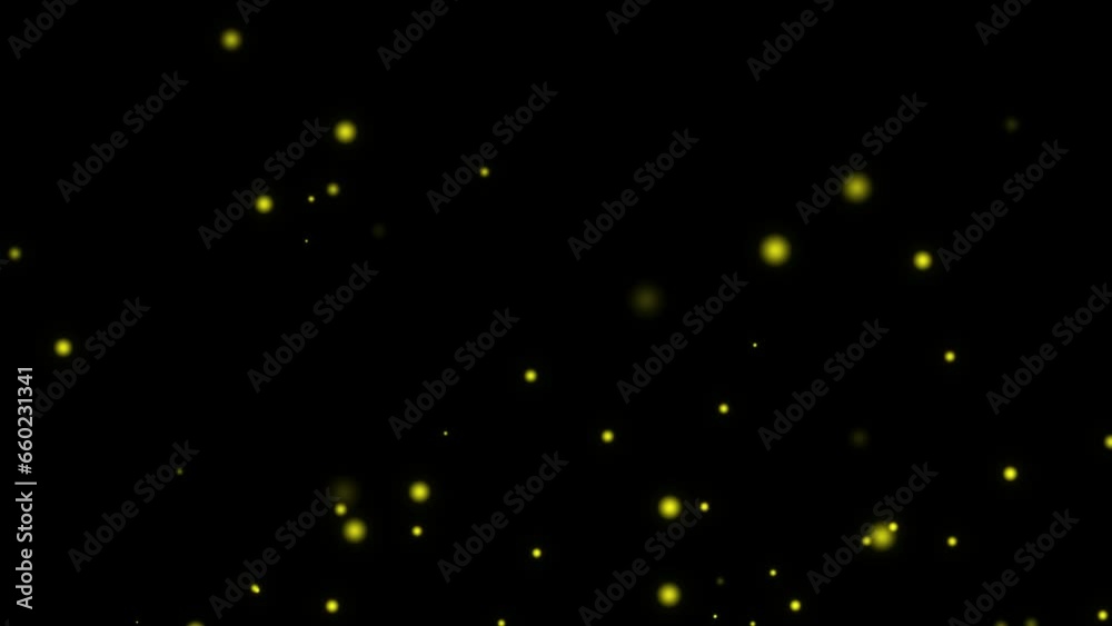 Partículas doradas con forma de círculos sobre fondo negro