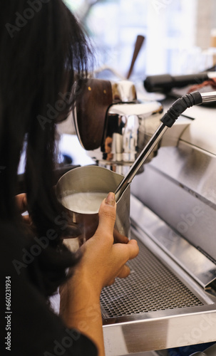 Barista Operating Espresso Machine