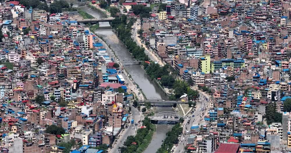 Busy Urban Asian City Kathmandu Nepal's Lifestyle. Drone Shot with Water Polluted environment and unmanaged urbanization. Bagmati river, Buildings, colorful, Tourist city, Cultural and greenery 4K Busy Urban Asian City Kathmandu Nepal's Lifestyle. Drone Shot with Water Polluted environment and unmanaged urbanization. Bagmati river, Buildings, colorful, Tourist city, Cultural and greenery 4K