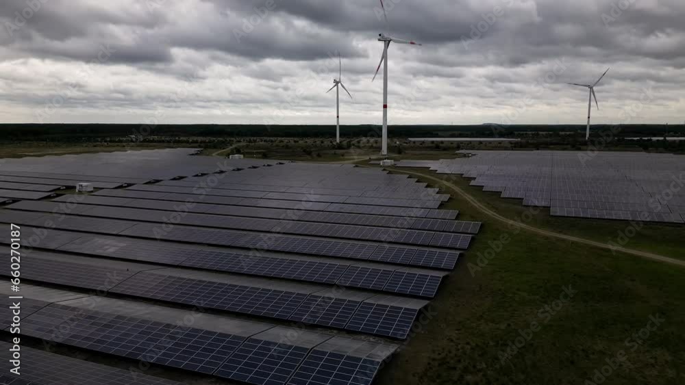 Solar and wind energy generated in fields of Belgium, aerial view Solar and wind energy generated in fields of Belgium, aerial view